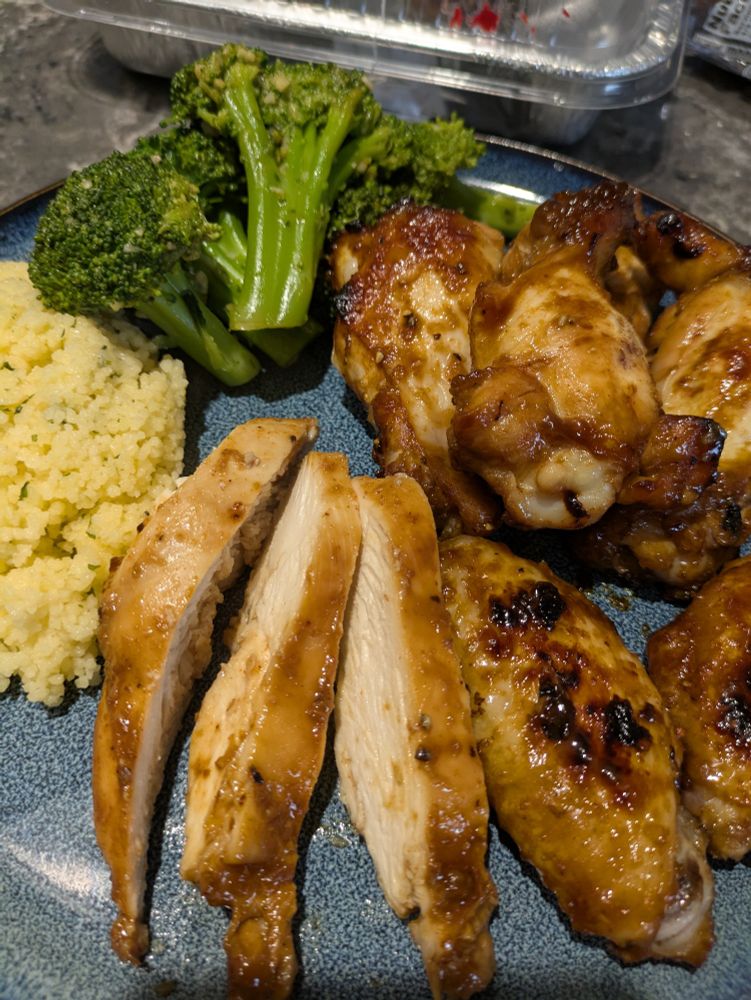 It is chicken, roasted, wings and breast meat glazed in honey and soy with couscous and garlic broccoli.