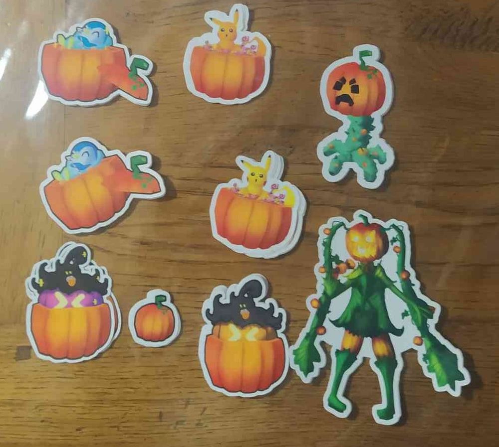 Pictures of the differents stickers, there is a halloween creeper with a pumpkin on, three pokemon in a pumpkin (Pumpkaboo stuck in one, piplup floating on a pumpkin soup with crossed armed under his head and sipping on a straw and pikachu in a candy filled one) and a hatsune miku theme around halloween, she has pumpkin head and skin and of her clothes is made with pumkins leaves, her hair strand too