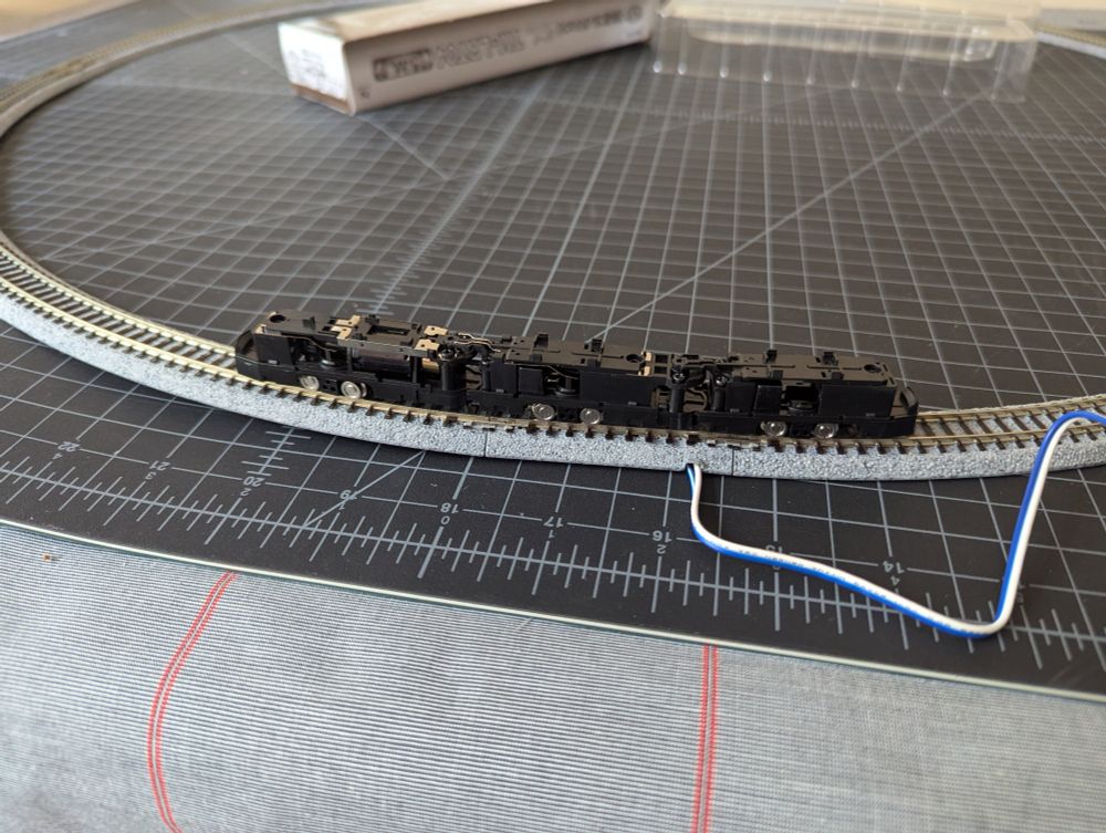 An N scale tram chassis on a small circle of track