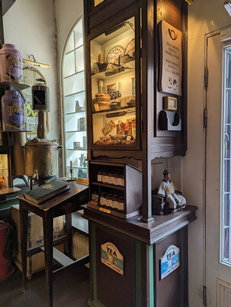 Cabinet of tea on the right have side of the room