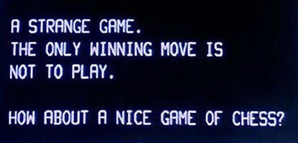 Jittery computer screen text taken from the movie 'War Games' which states "A strange game. The only winning move is not to play. How about a nice game of chess?"