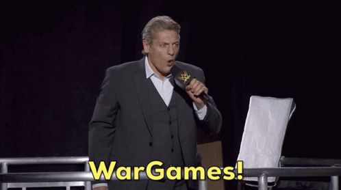 WWE Superstar William Regal shouting the phrase "War Games!" into a microphone, with subtitled text.