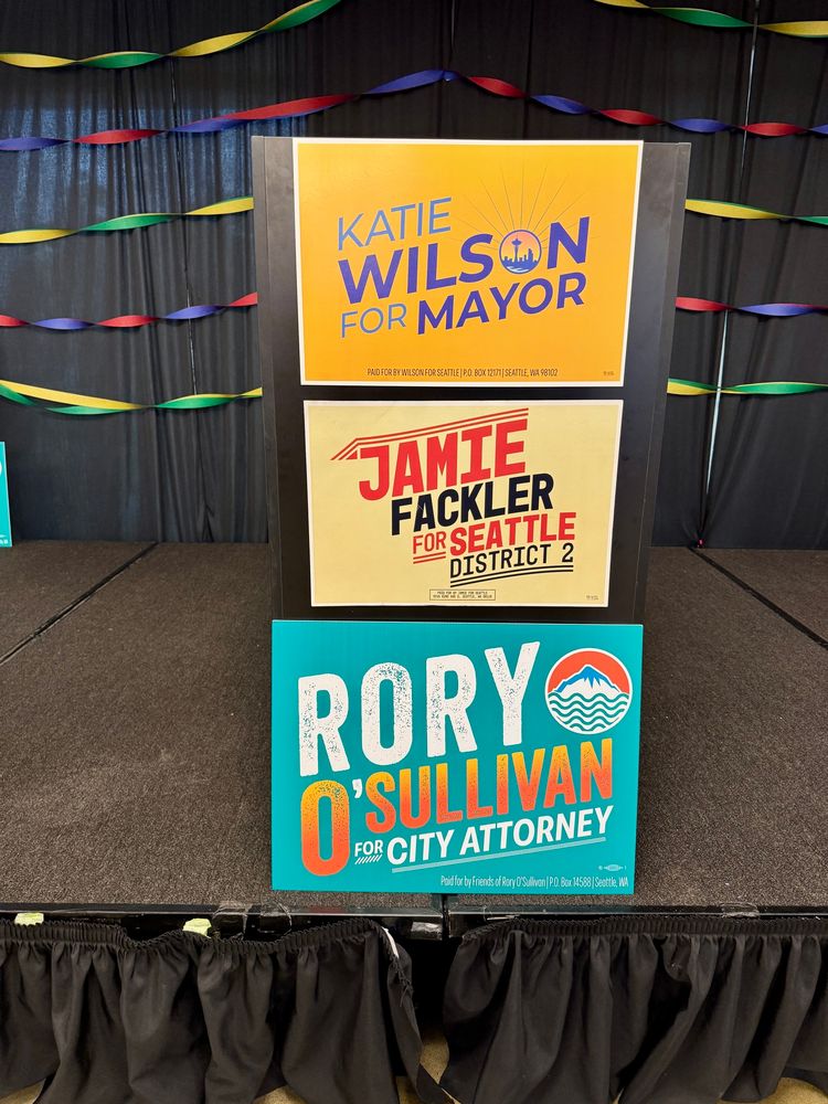 Katie Wilson, Rory O’Sullivan, and Jamie Fackler campaign signs.