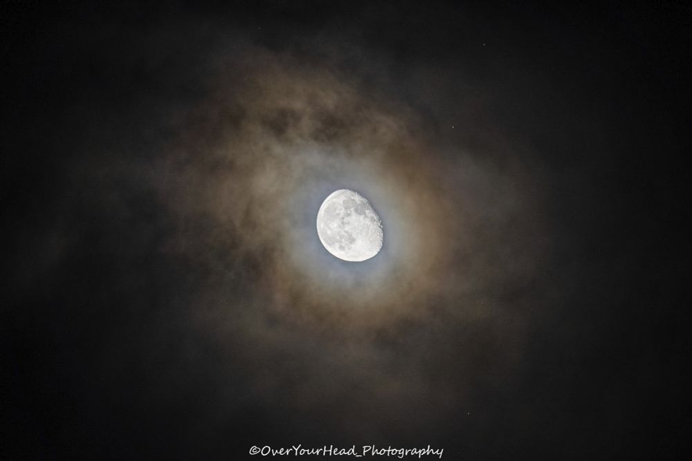 The Moon, surrounded by clouds