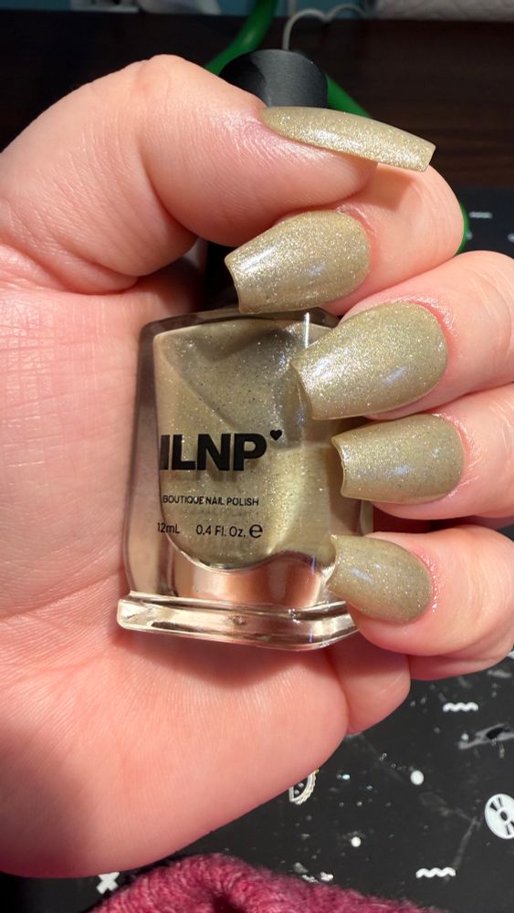 ILNP “Cashmere,” a pale beige nail polish with silver magnetic shimmer (worn unmagnetized)