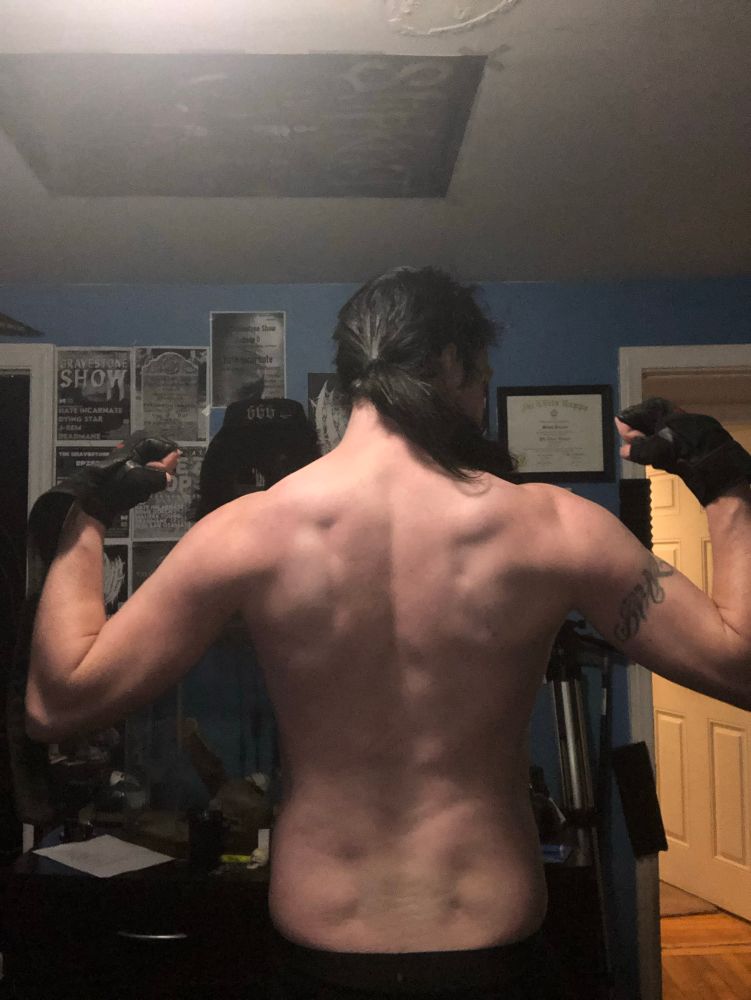 Big Daddy Death flexing his back.