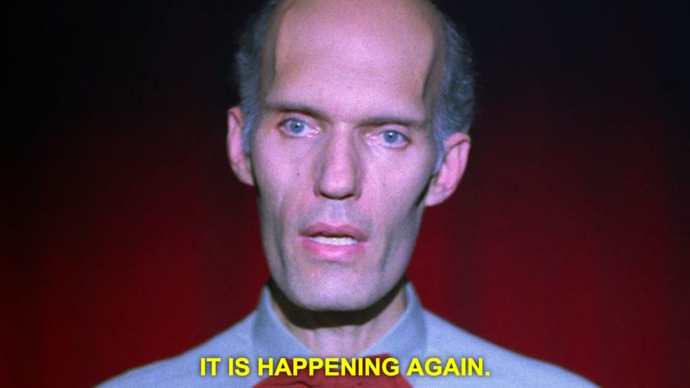 The Giant/Fireman from "Twin Peaks," warning us that it is happening again