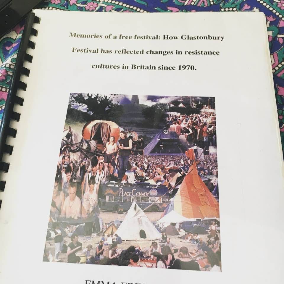 Photo of a ring-bound dissertation titled: memories of a free festival: how Glastonbury festival has reflected changes in resistance culture in Britain since 1970. It’s illustrated with a collage of pictures of Glastonbury over the years created by somebody who loved a bit of terrible photo editing software in the early 00s.