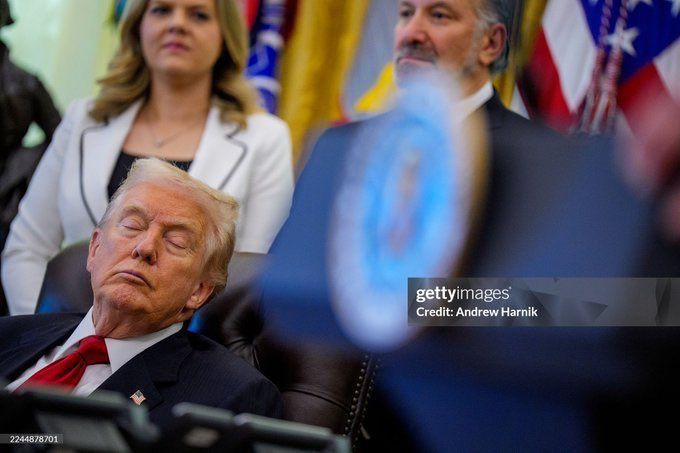 Donald Trump dozing in his chair at a press conference in the Oval Office, surrounded by people. November 7 2025.