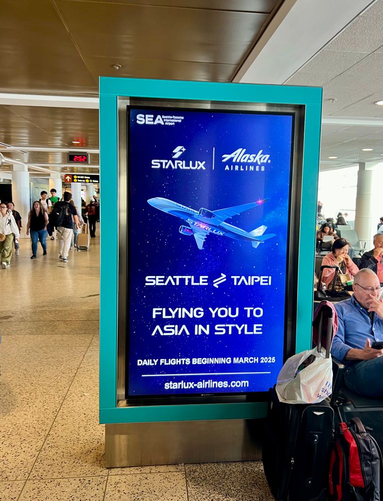 Image of display advertising at SEA for Starlux new Seattle-Taipei route 