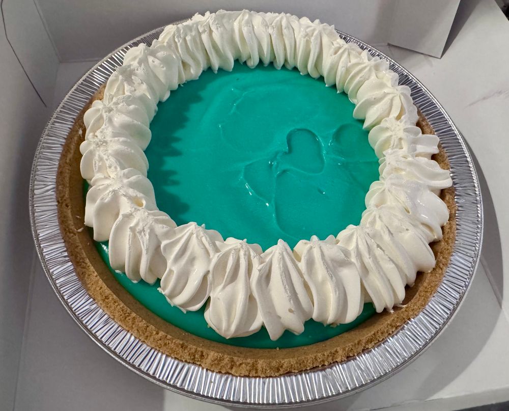 Wow, that is...yeah that is definitely Baja Blast coded. Turquoise goop sits on top of a graham cracker crust and is topped with a ring of whipped cream.