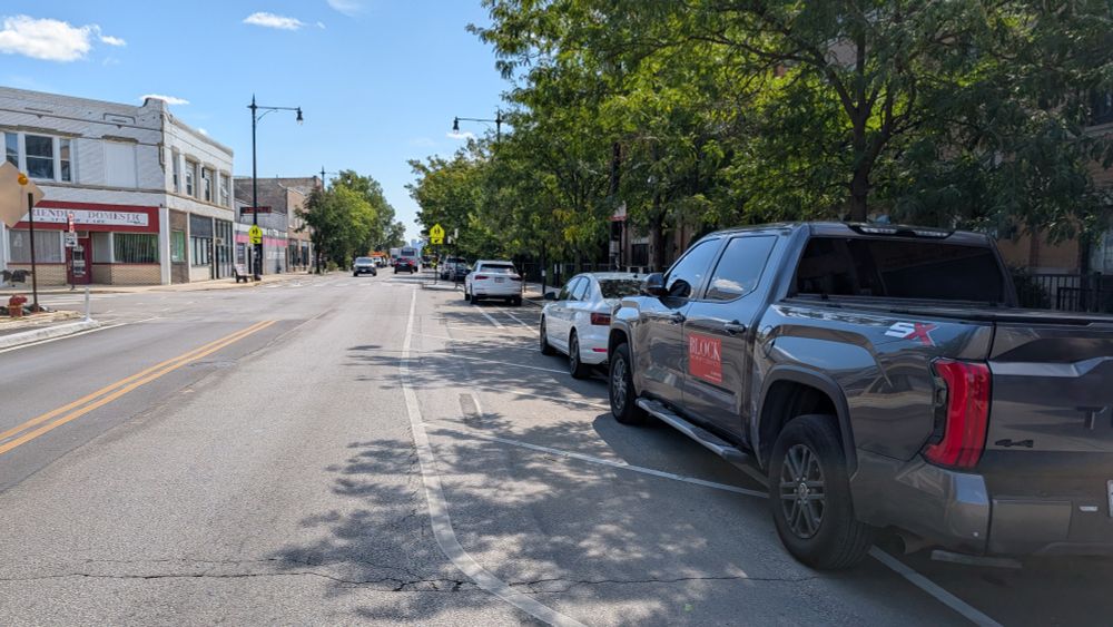 Vehicles parked in the south bound bike lane on Milwaukee south of Addison