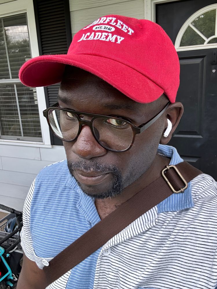 jamelle in a red “starfleet academy” hat

