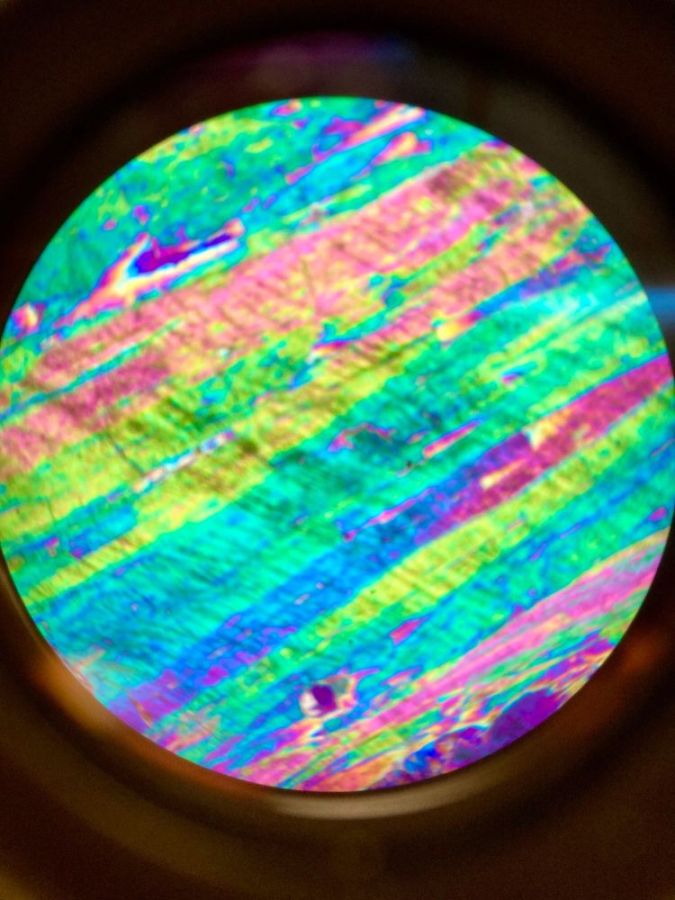 Minerals viewed through a petrographic microscope in cross polarized light.