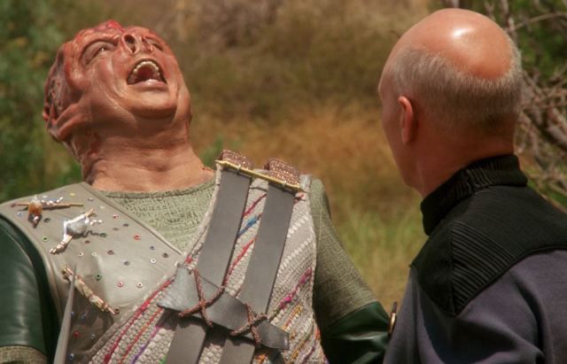 Tamarian Captain Dathon (Paul Winfield) cheers to the heavens because Picard has figured out how to speak with him