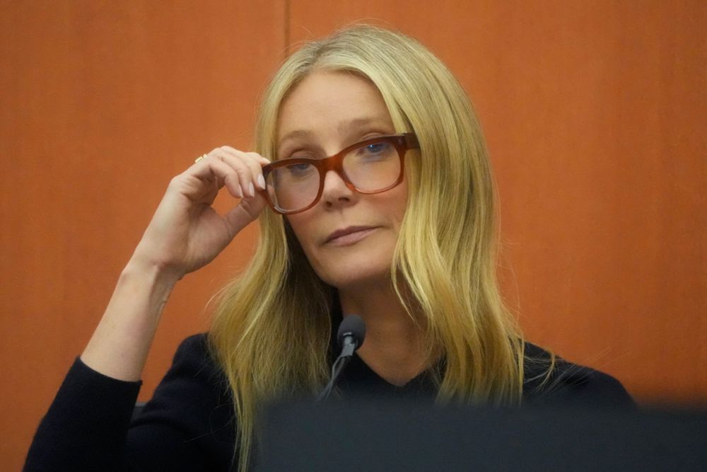 Gwyneth Paltrow in the courtroom for her ski trial. She’s wearing a black shirt and glasses. 