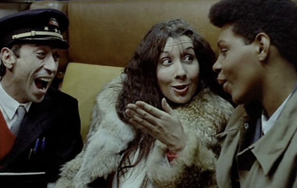 Three people on a train in the film Maine Ocean (1986)