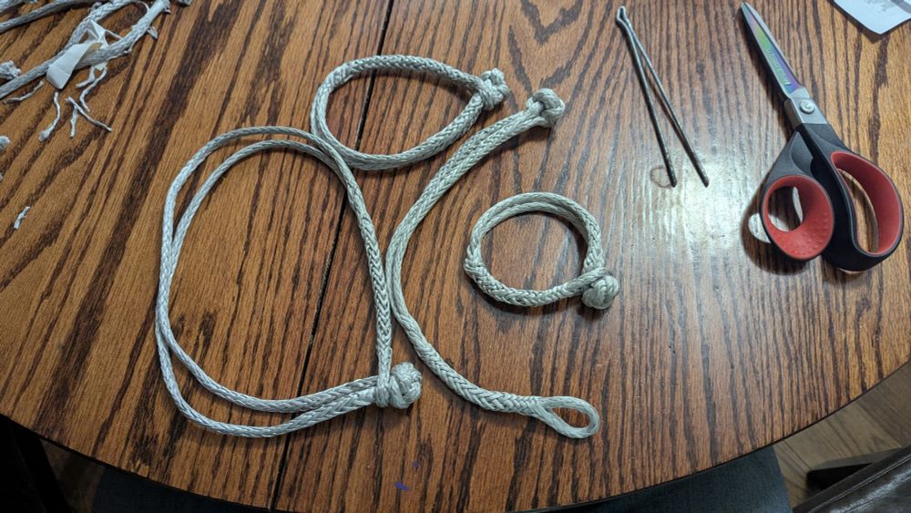 Four dyneema soft shackles of varying length lay on a table. 