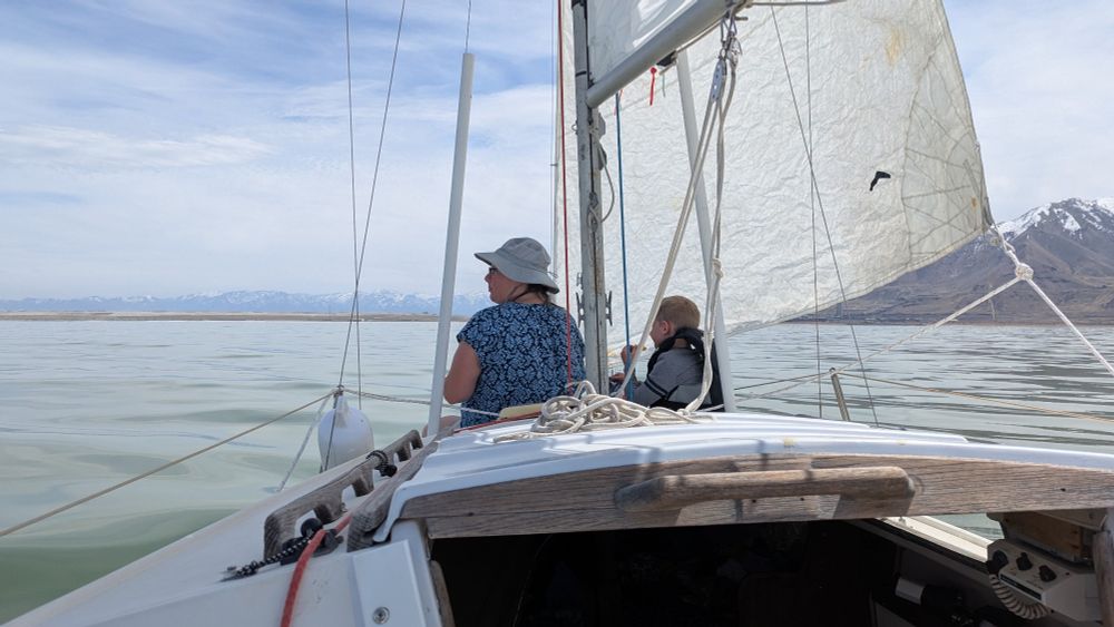 Nikki and Warren having some Doritos and enjoying a warm sunny sail