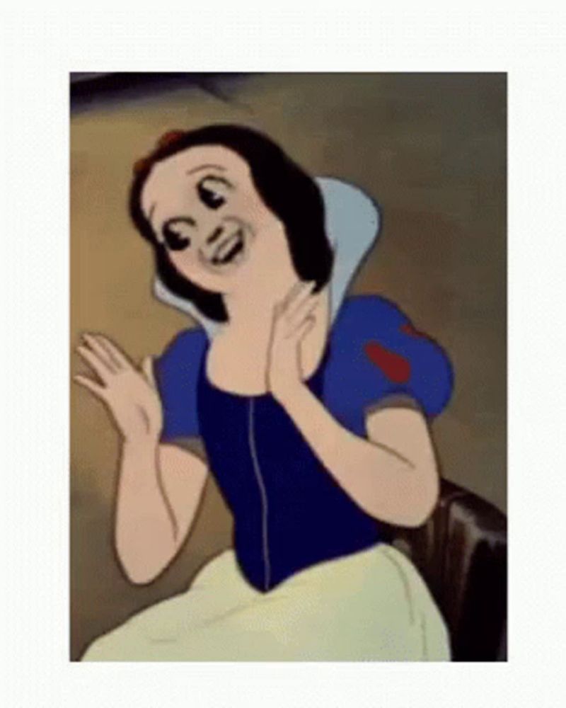 snow white from snow white and the seven dwarfs is making a funny face while sitting in a chair .