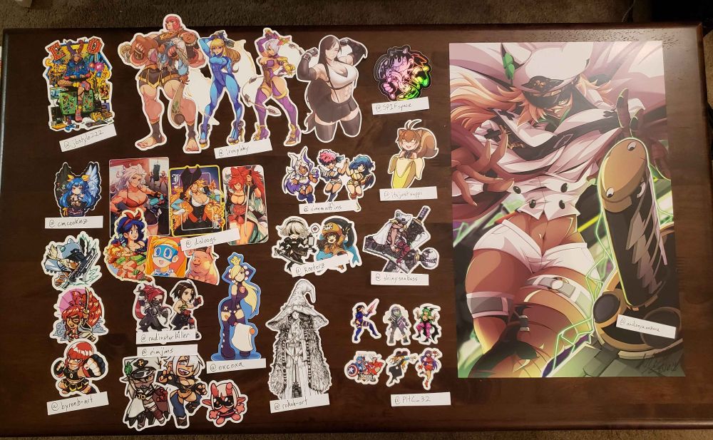 photo of various stickers and a print arranged on a table