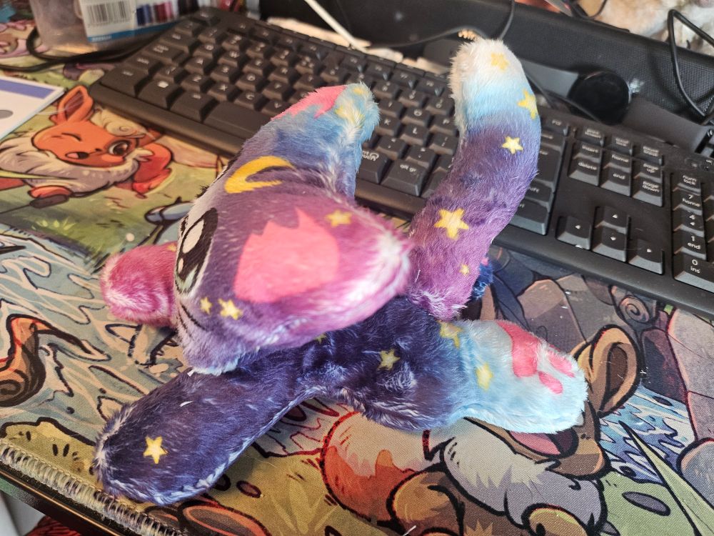 Nova plush on her left side