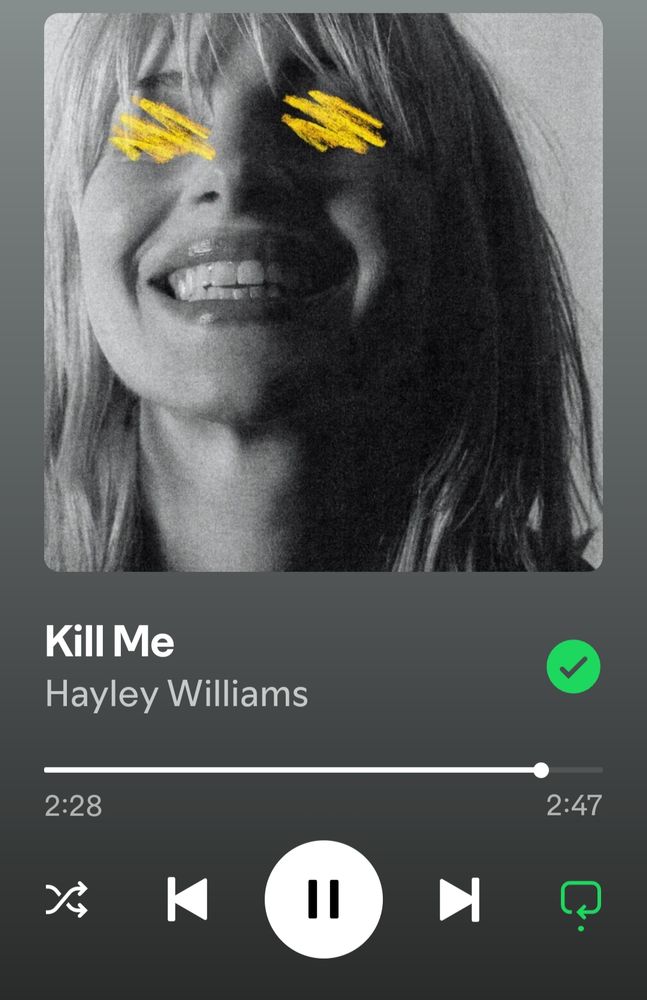 Screenshot of Spotify playing "Kill Me" by Hayley Williams. The song is near it's end. The artwork is a back and white photo of Hayley Williams face with yellow lines drawn over the eyes. 