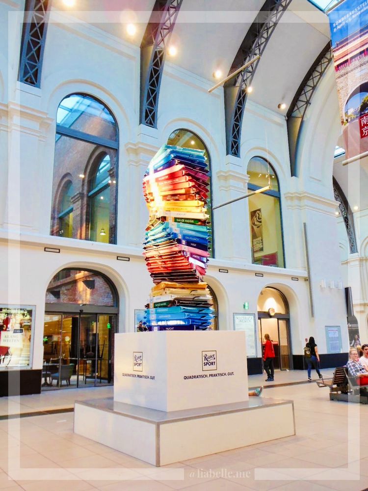 A picture is showing chocolates that look a lot like books at Dresden Central Station