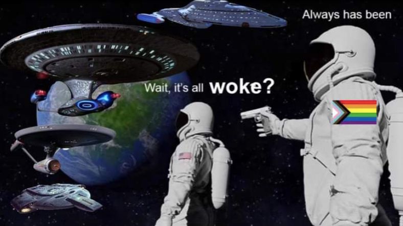 "Always was" meme where the gun holder has a Progress Pride patch and text reads "wait it's all woke?" and response is "always has been" with four Star Trek ships orbiting the planet

-my hand is injured so sorry this alt text is so bad