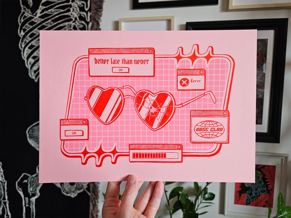 Linocut of y2k inspired broken heart-shaped glasses surrounded by dialogue windows, printed in red ink on pink paper