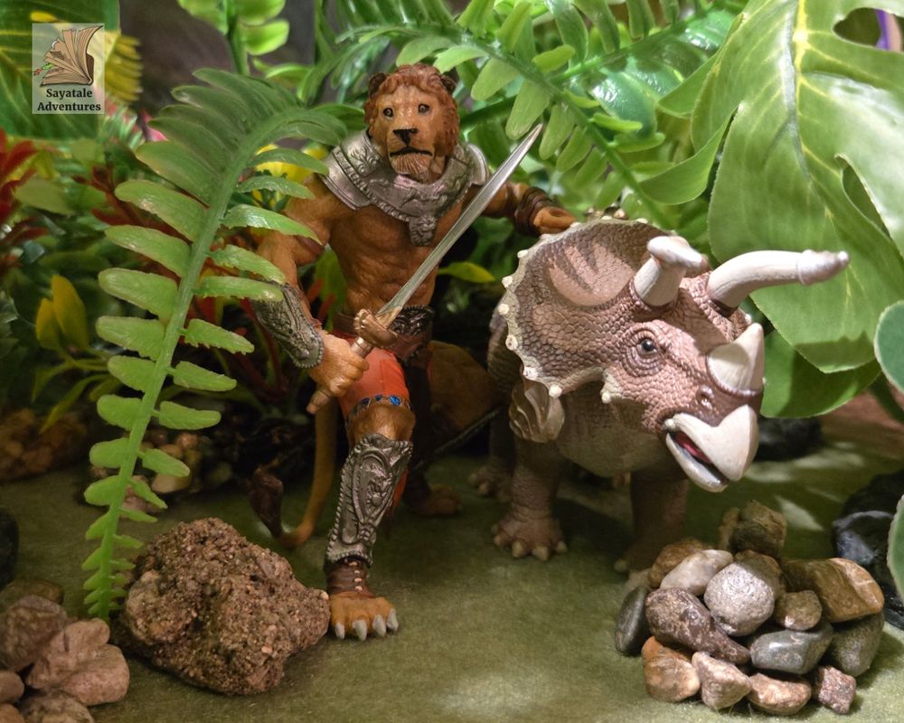 Photo of a toy humanoid lion with an armored triceratops. They are shown walking through jungle plants. The lion-person is facing the camera with a sword in one hand.