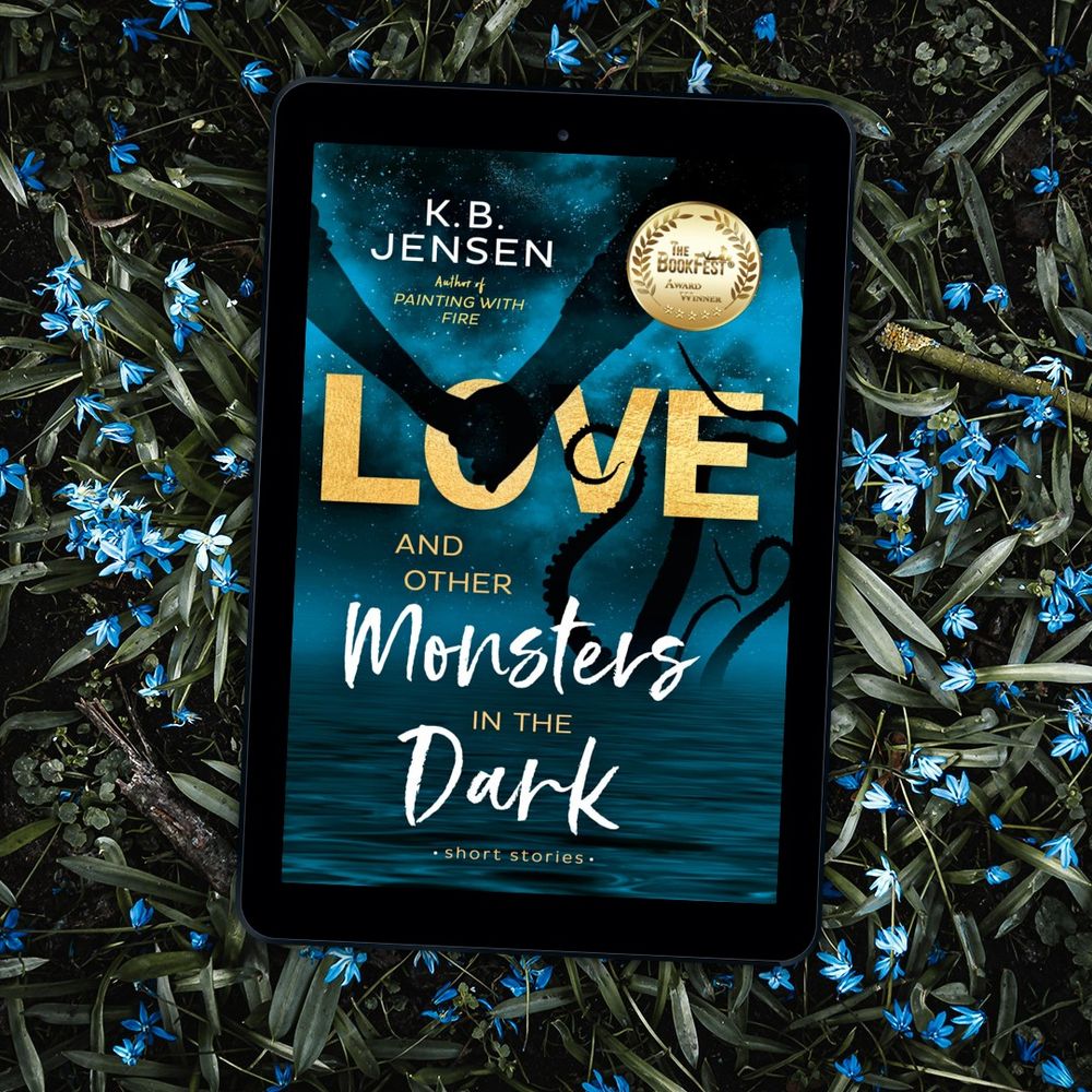 Kindle image of the cover of Love and Other Monsters in the Dark with water, mist, a kraken and a silhoute of a couple holding hands. Also a gold medal award seal.