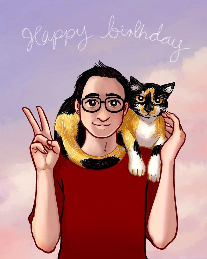 Bespectacled guy with his calico cat