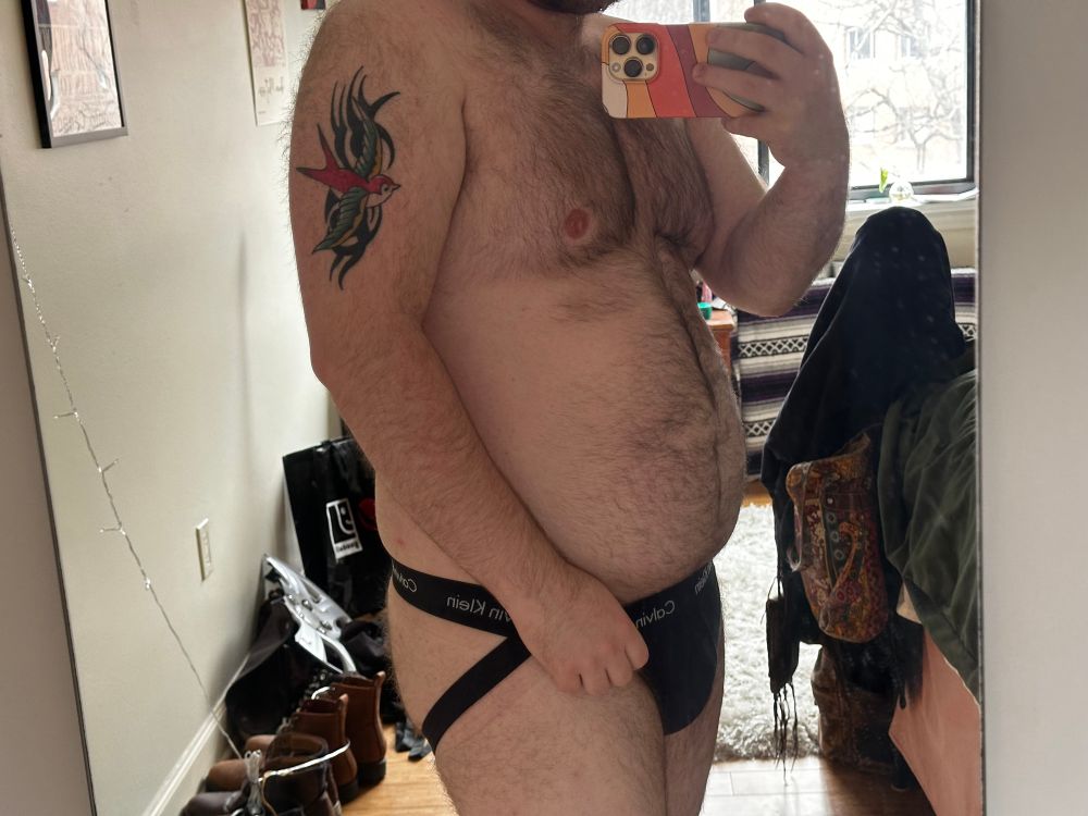 Mirror pic from thighs to chest of me in a black Calvin Klein jockstrap
