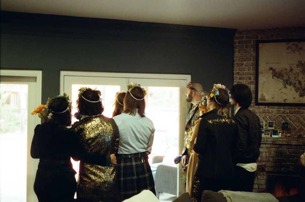 A back view of some of our closest friends and family looking through French doors. 
