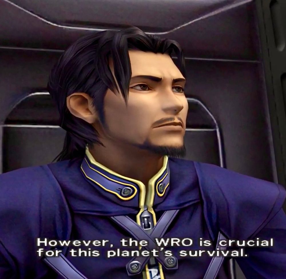 Screencap from Dirge of Cerberus. Reeve Tuesti looks at Vincent (offscreen) with a serious expression, saying, “However, the WRO is crucial for this planet’s survival.” 