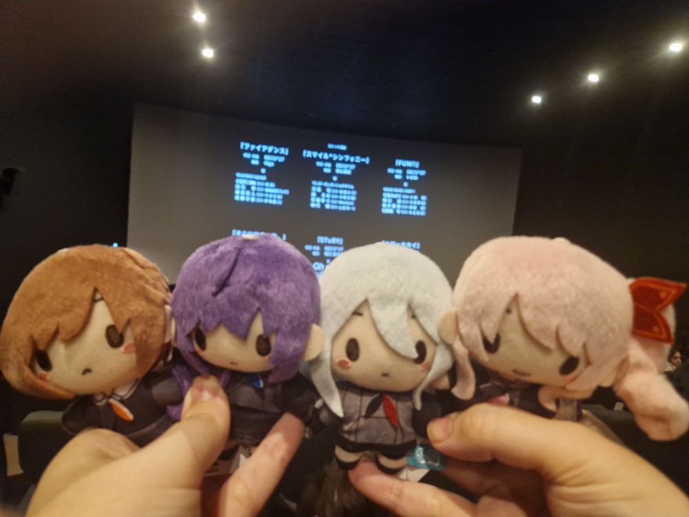 The Niigo nuis with a backdrop of the credits of the Project Sekai movie.