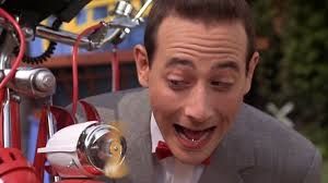 Pee-wee looking at the spinner on the front of his bike