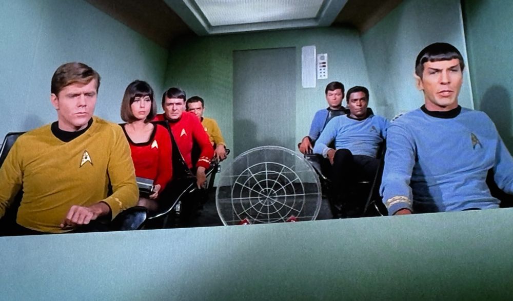 Star Trek original series showing seven members of the crew aboard a shuttlecraft. 