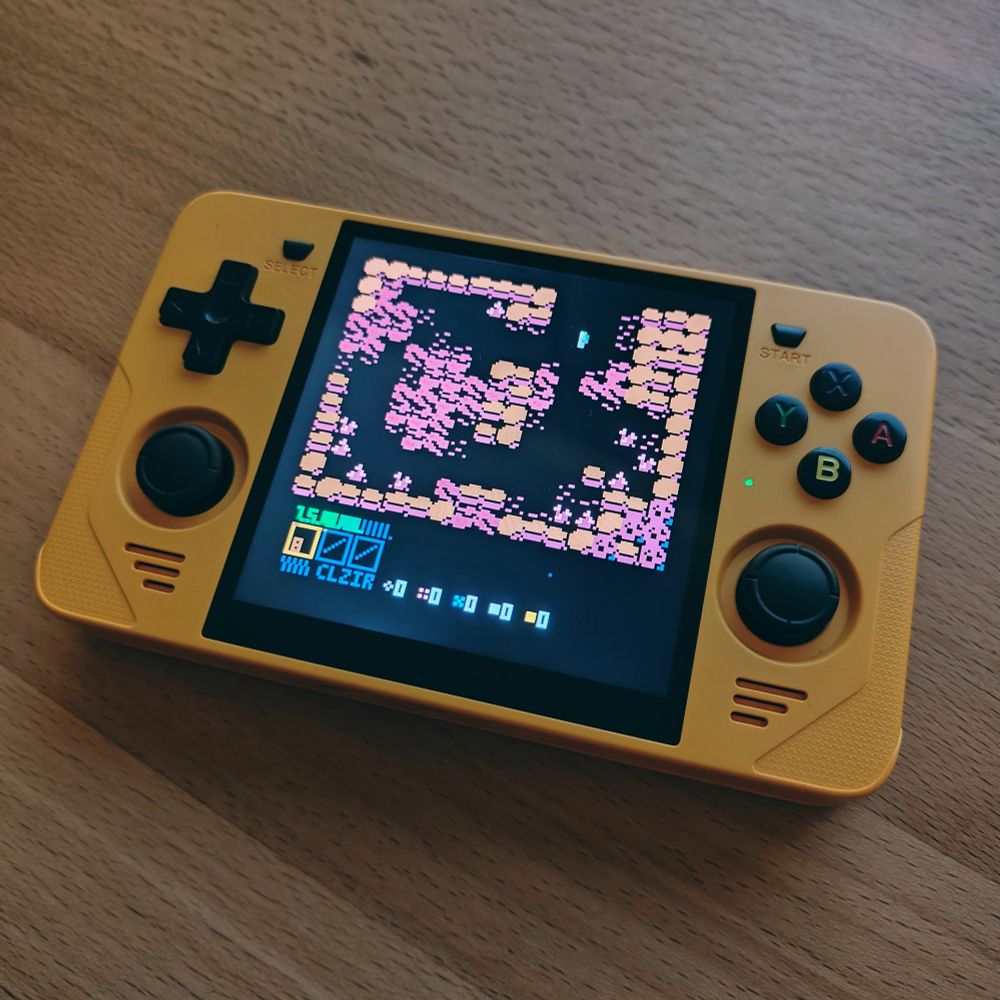 A photo of a Powkiddy RGB30 handheld gaming device showing my game named SPHONGOS in the Pico-8 game browser splore
