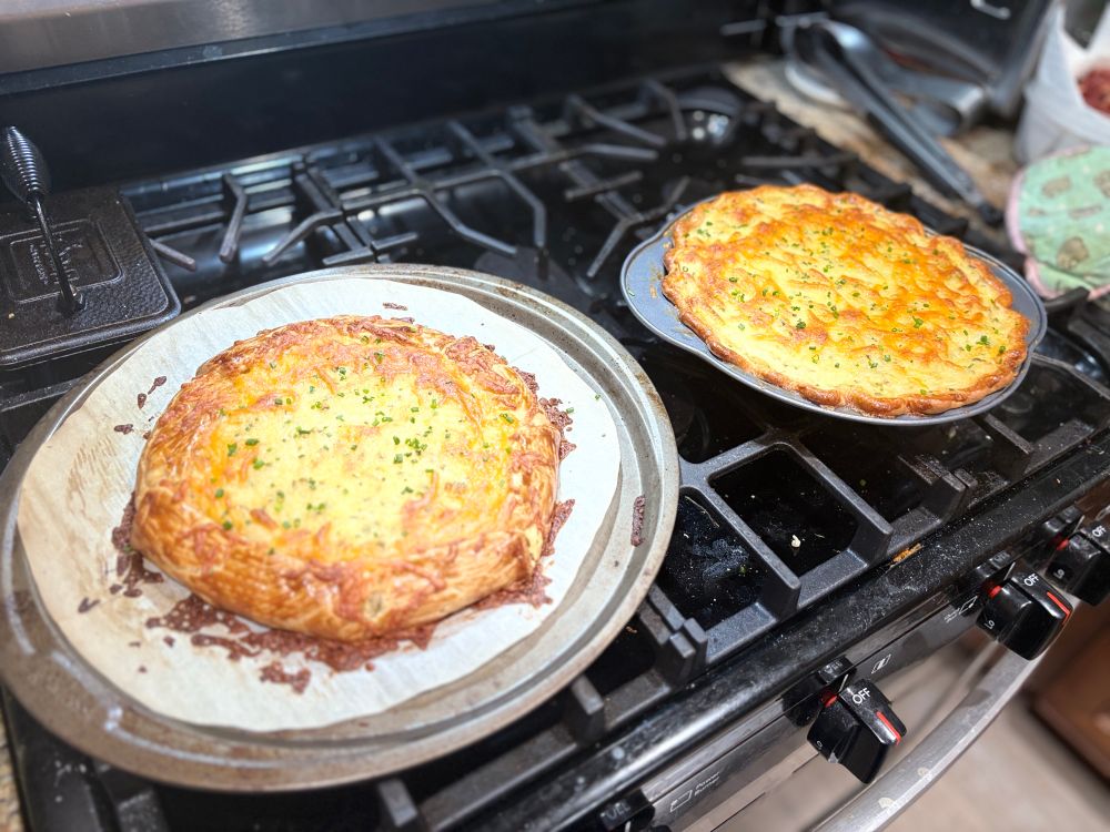 The same galette next to a Shepard’s pie on top of an oven