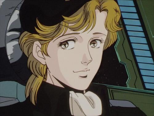 Close-up of Frederica Greenhill, a Lieutenant in the Free Planet Alliance Navy from the 1986 anime rendition of "Legend of the Galactic Heroes". 

She has dark blonde hair, amber eyes, and pale skin and lips. Her uniform is dark green with a matching beret and a beige tie.
