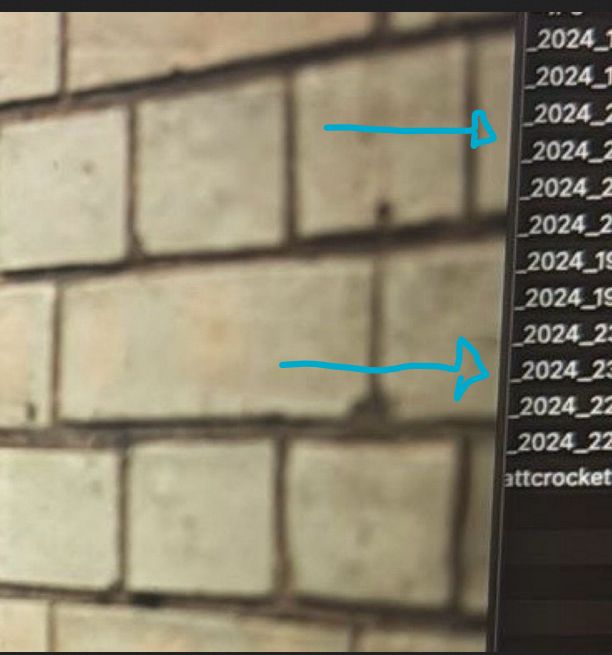 cropped version of a photograph showing Mark Watson leaning against a pale brick wall. On the right is a list of what appears to be filenames. Mostly _2024_ is visible on all of them, with the hint of other numbers following. The last one shows a fragment "attcrocket"