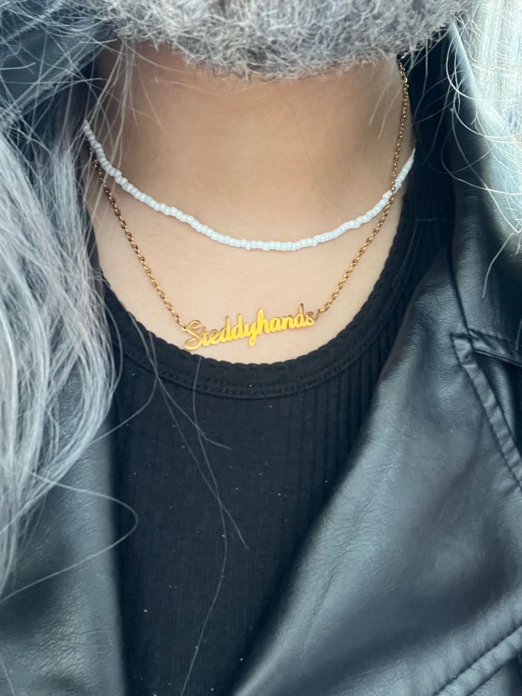 Ed cosplay featuring a necklace that reads "Steddyhands"