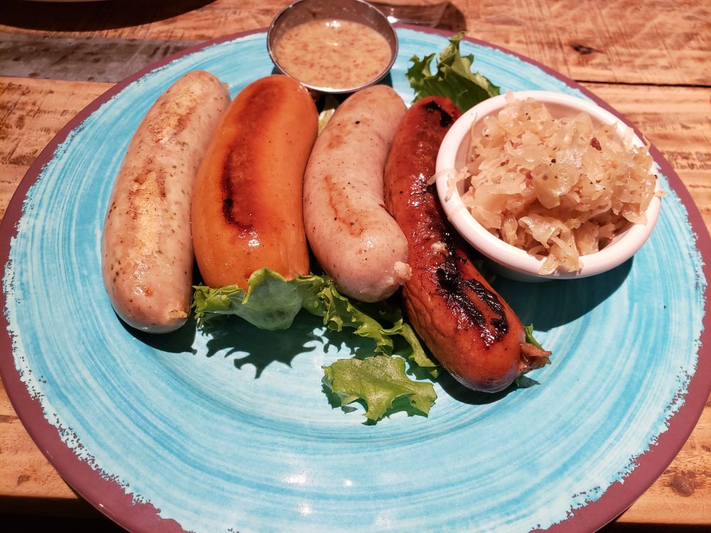 Four sausages with kraut and mustard