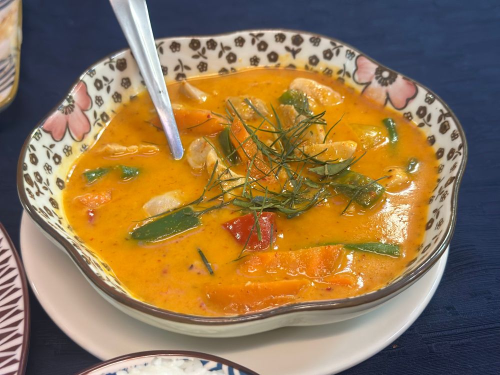 Penang curry with vegetavles and chicken in a cute flower shaped dish
