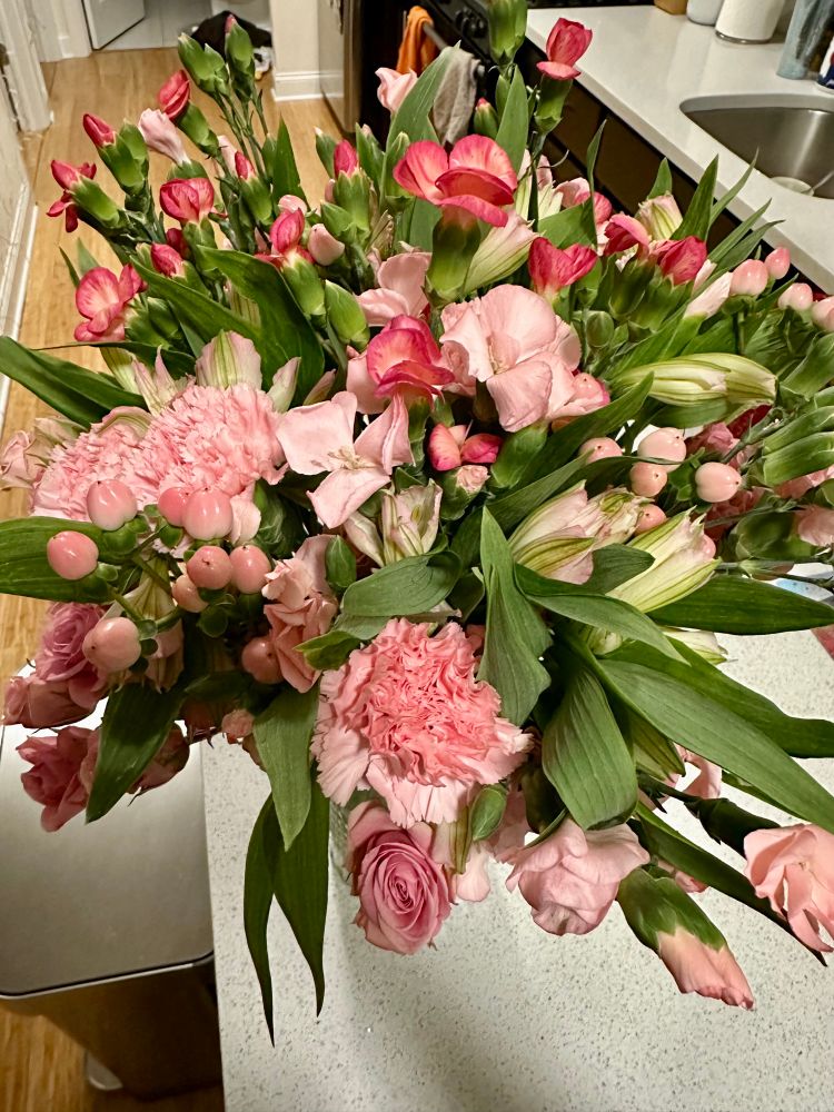 top view of flower bouquet with various pink trader joe’s flowers 