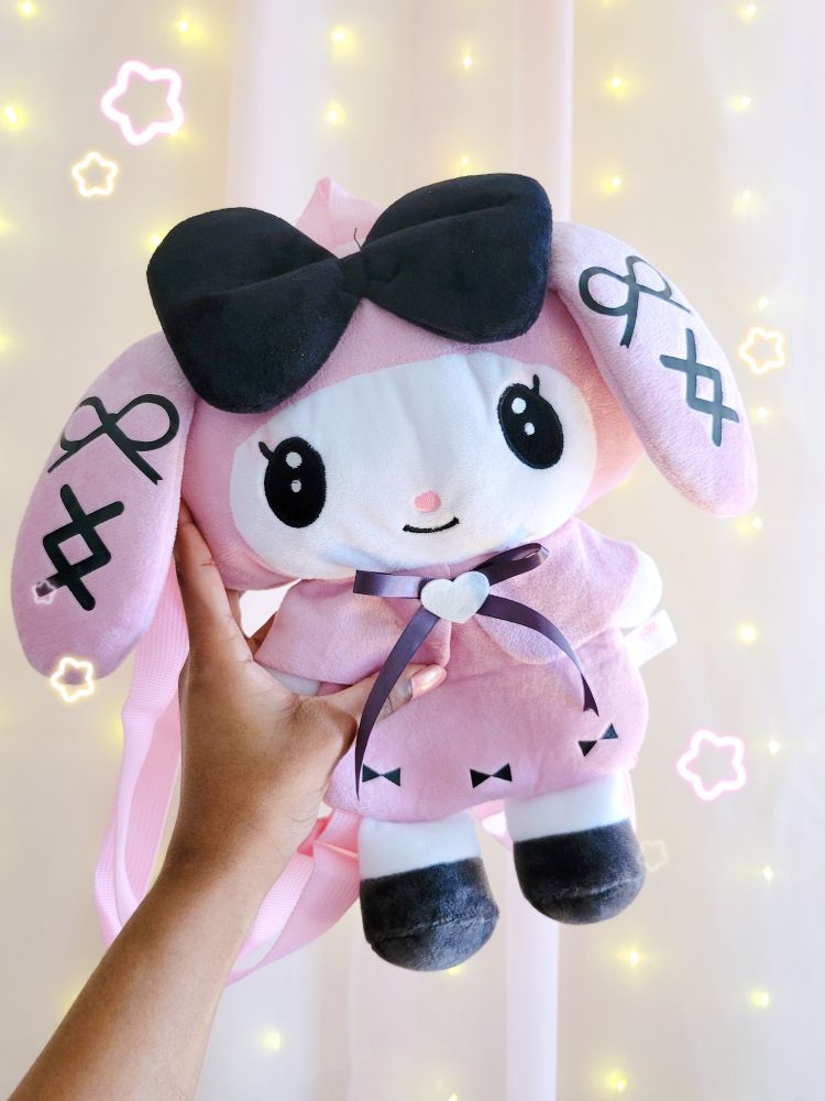a picture of me holding up a pink my melody jirai kei themed backpack