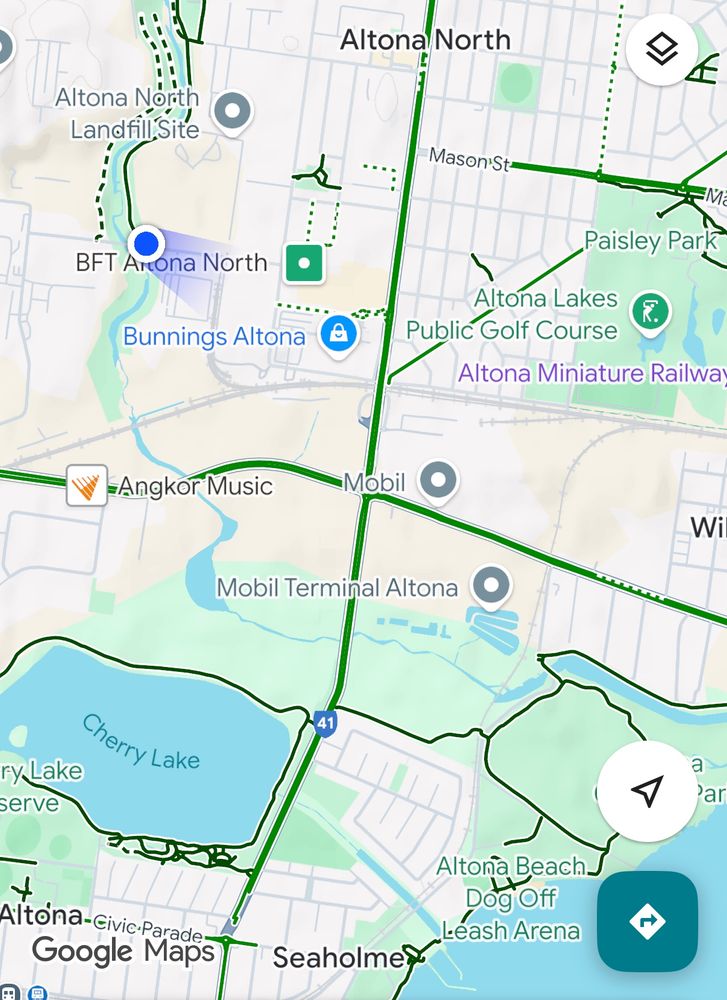 Map with blue location dot at the end of the trail, no green bike paths down to the coast. 