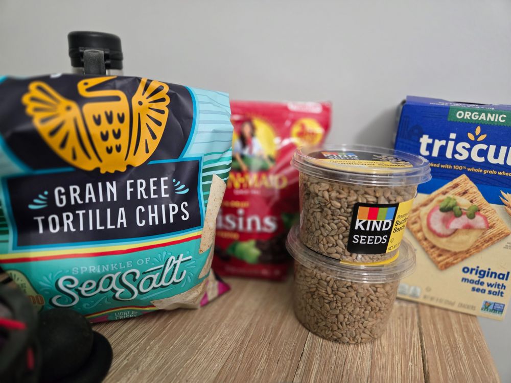 Grain-free tortilla chips, raisins, sunflower seeds, and Triscuits